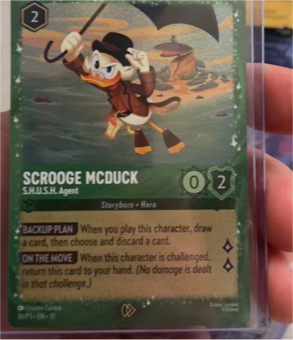 Lorcana Scrooge McDuck S.H.U.S.H. Agent Glimmer Foil Promo — front