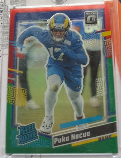 2023 Panini Donruss Optic #357 Puka Nacua Rated Rookie Red & Green Prizm — front