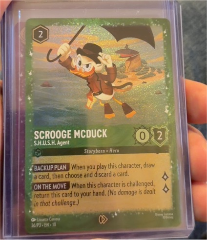 Lorcana #36 Scrooge McDuck S.H.U.S.H. Agent Glimmer Foil Promo — front