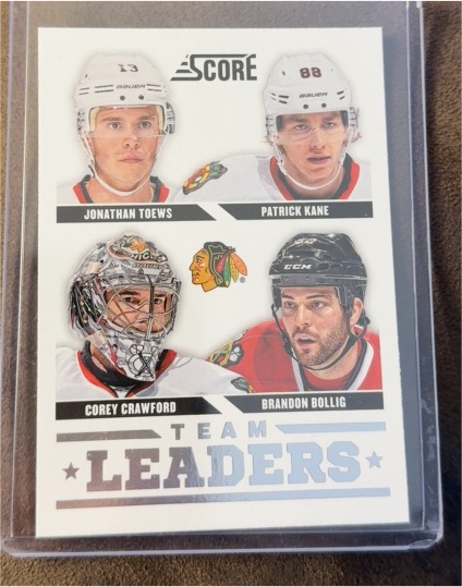 2013-14 Score #556 Jonathan Toews Patrick Kane Corey Crawford Brandon Bollig — front
