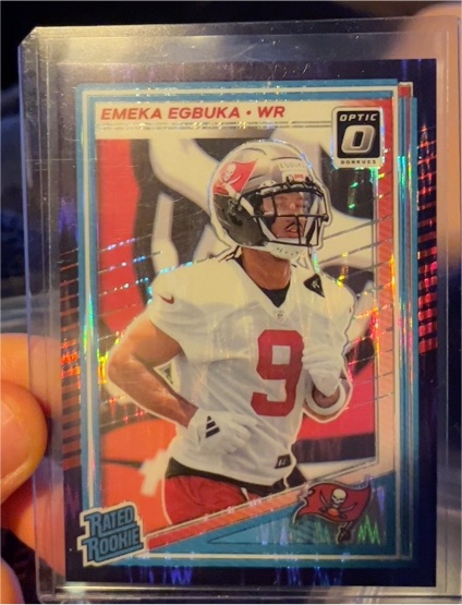 2025 Donruss Optic #265 Emeka Egbuka Rated Rookie Purple Shock Prizm — front
