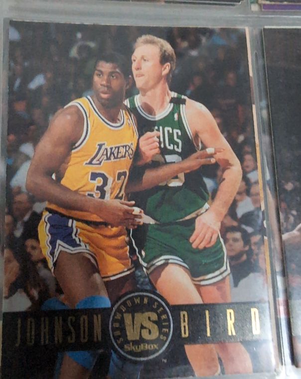 1993 Skybox Premium Showdown Series #SS12 Magic Johnson / Larry Bird — front