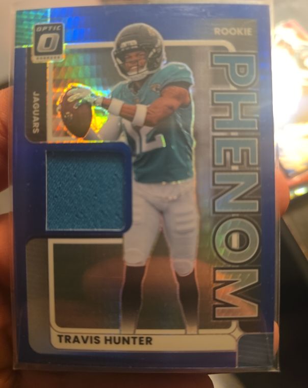 2025 Panini Donruss Optic #RPBH-THR Travis Hunter Rookie Phenom Blue Hyper Patch — front