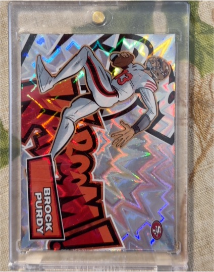 2025 Panini Absolute Kaboom! Horizontal #25 Brock Purdy — front