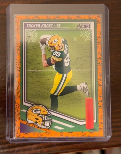 2025 Panini Score #35 Tucker Kraft Pumpkin Parallel — front