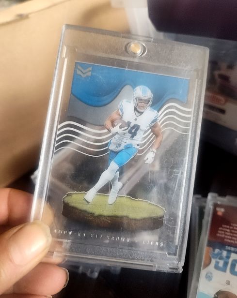 2022 Panini Chronicles Magnitude #MAG-23 Amon-Ra St. Brown — front