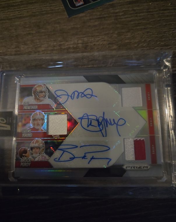 2025 Panini Prizm Triple Patch Auto #/99 Joe Montana Steve Young Brock Purdy — front