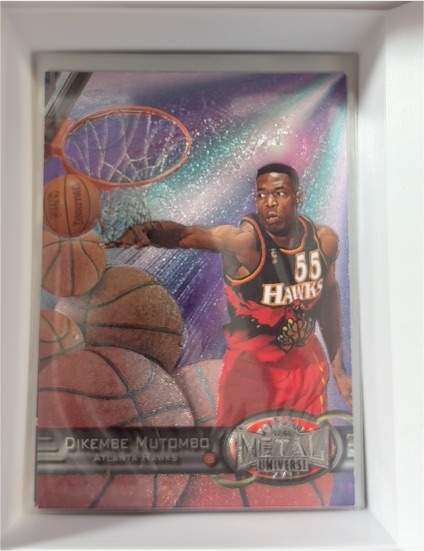 1997-98 Skybox Metal Universe #106 Dikembe Mutombo — front