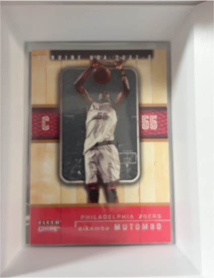 2002-03 Fleer Genuine #73 Dikembe Mutombo — front