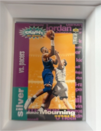1995-96 Upper Deck Collector's Choice Crash the Game Silver #C9 Alonzo Mourning — front
