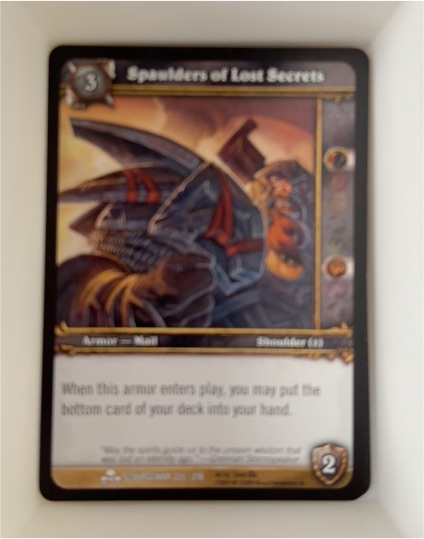2009 World of Warcraft TCG #225 Spaulders of Lost Secrets — front