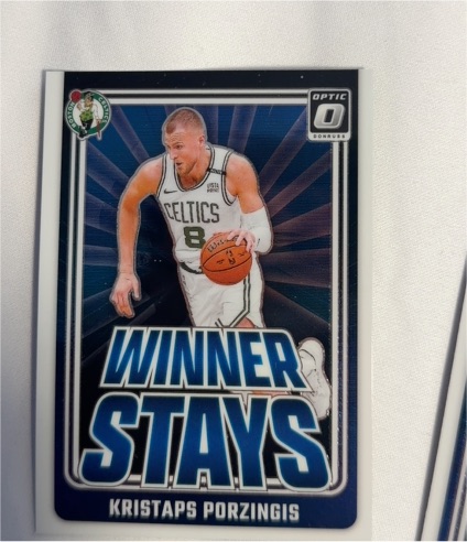 2024-25 Donruss Optic #9 Kristaps Porzingis Winner Stays Boston Celtics — front