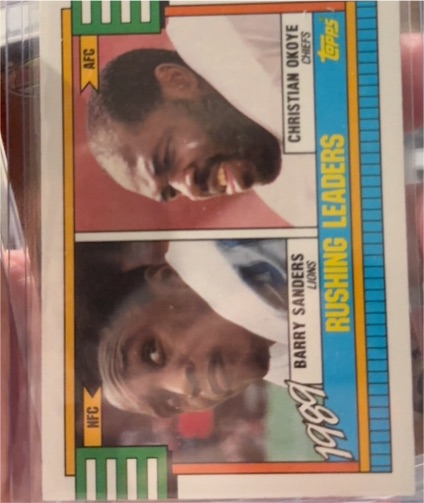1990 Topps #28 1989 Rushing Leaders Barry Sanders / Christian Okoye — front