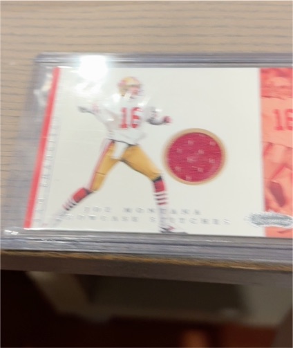 2001 Fleer Showcase #NNO Joe Montana Showcase Stitches — front