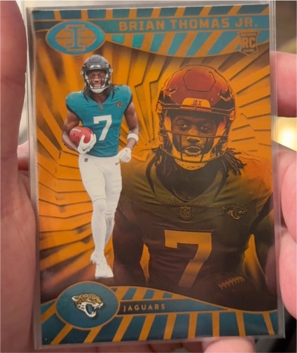 2024 Panini Illusions #41 Brian Thomas Jr. Trophy Collection Orange Rookie — front