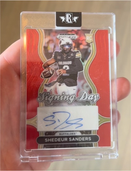 2025 Panini Prizm Draft Picks Shedeur Sanders Signing Day Auto Red #/100 — front