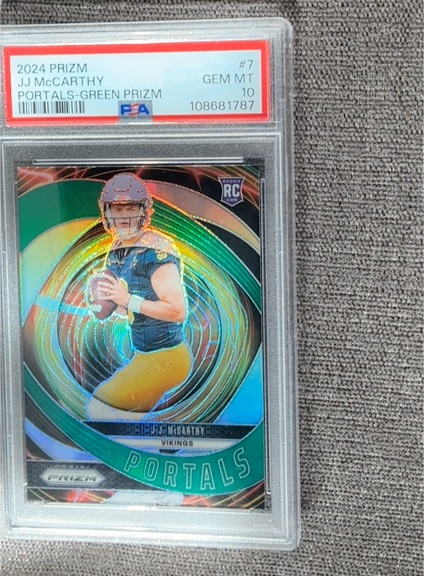 2024 Panini Prizm Portals #7 J.J. McCarthy Green Prizm Rookie — front