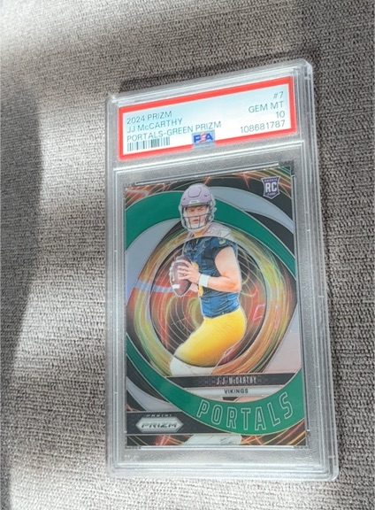 2024 Panini Prizm Portals #7 J.J. McCarthy Green Prizm Rookie Card — front