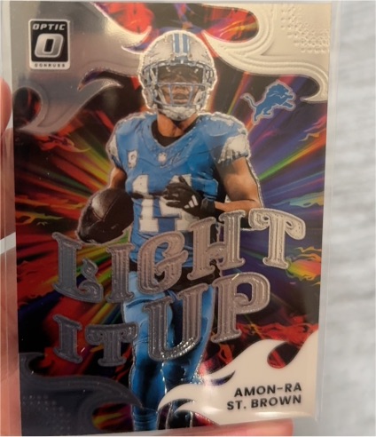 2025 Donruss Optic #15 Amon-Ra St. Brown Light It Up — front