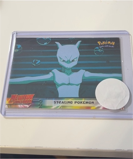 1999 Topps Mewtwo Strikes Back #27 Stealing Pokemon — front