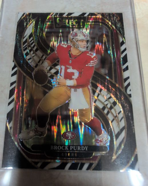 2024 Panini Select #124 Brock Purdy Black & Red Shock Prizm — front