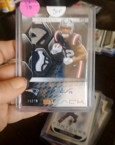 2025 Panini Black #10 TreVeyon Henderson Rookie Patch Autograph — front