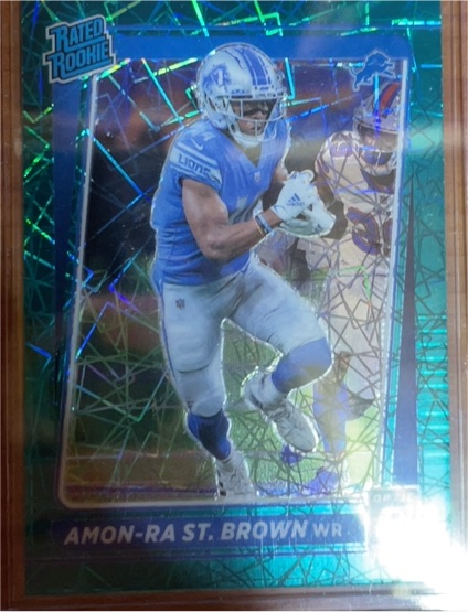 2021 Donruss Optic #228 Amon-Ra St. Brown Rated Rookie Green Velocity Prizm — front