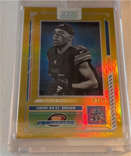 2023 Panini Score #81 Amon-Ra St. Brown Gold Zone — front