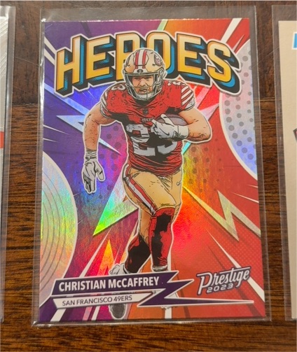 2023 Panini Prestige #H-9 Christian McCaffrey Heroes — front