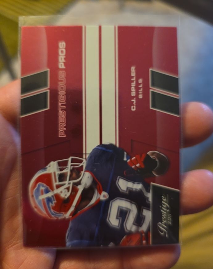 2011 Panini Prestige Prestigious Pros Red #7 C.J. Spiller — front