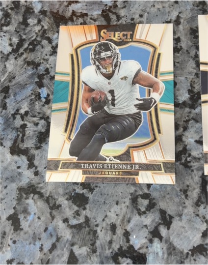 2025 Panini Select Premier Level #130 Travis Etienne Jr. — front