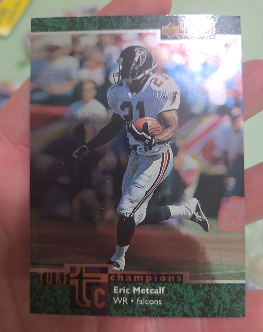 1997 Upper Deck Collector's Choice Turf Champions #TC23 Eric Metcalf — front