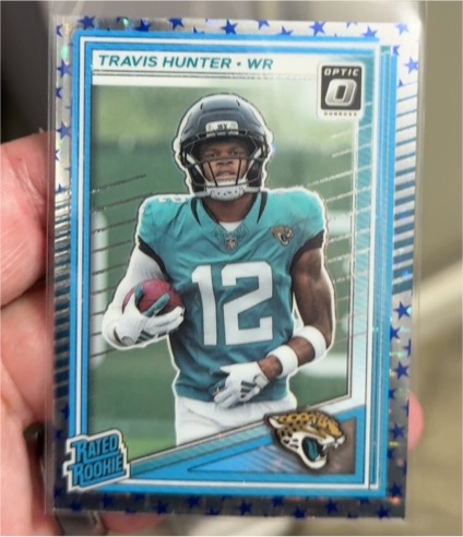 2025 Panini Donruss Optic #201 Travis Hunter Rated Rookie Stars Prizm Jaguars — front