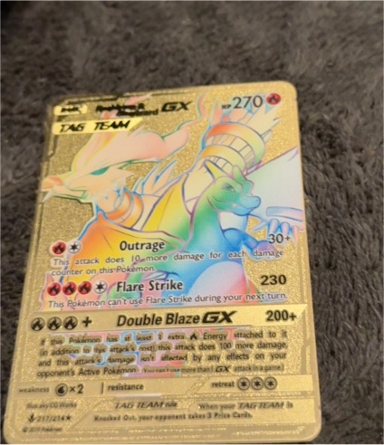 2019 Pokémon #217 Reshiram & Charizard GX TAG TEAM Gold Metal — front