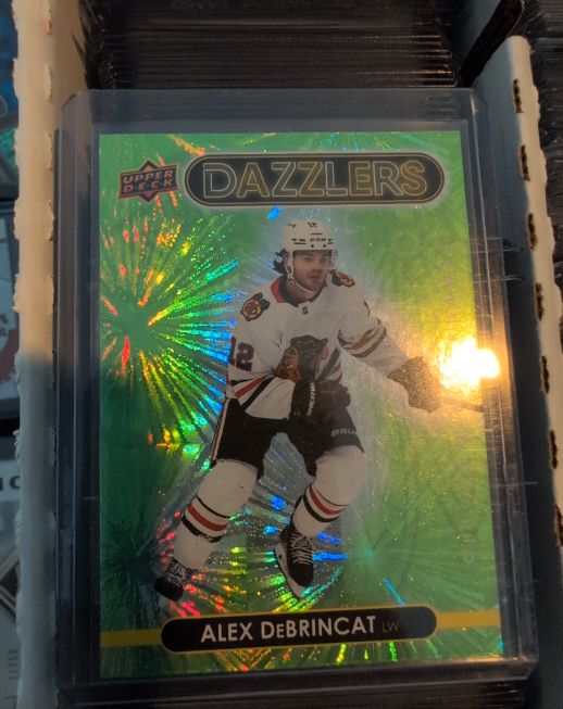 2021-22 Upper Deck Series 1 Dazzlers Green #DZ-11 Alex DeBrincat — front