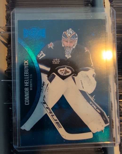 2021-22 Skybox Metal Universe Blue Spectrum #85 Connor Hellebuyck — front