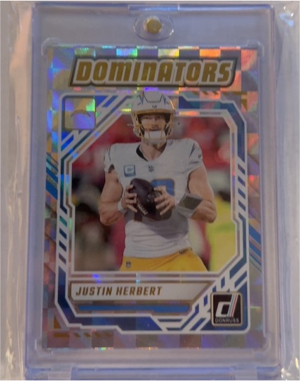 2025 Panini Donruss #DOM-JHT Justin Herbert Dominators — front