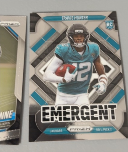 2025 Panini Prizm #12 Travis Hunter Emergent Rookie Card — front