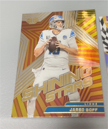 2023 Panini Illusions #9 Jared Goff Shining Stars — front