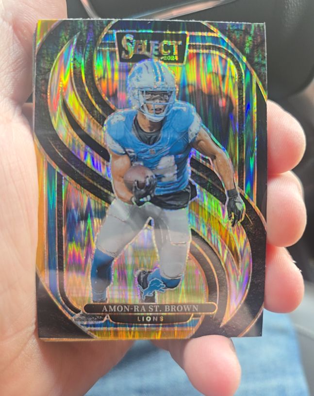2024 Panini Select #105 Amon-Ra St. Brown Premier Level Red & Blue Shock — front