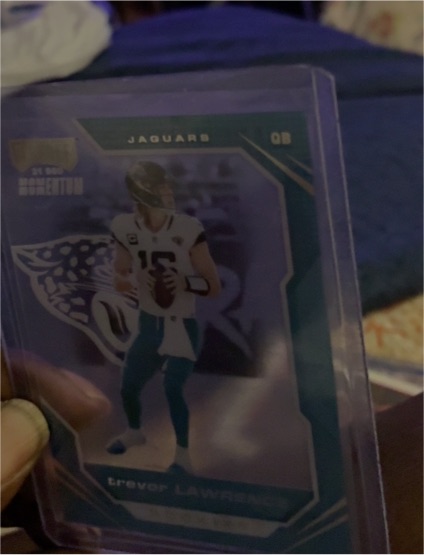 2021 Panini Chronicles Playoff Momentum Rookies #PMR-1 Trevor Lawrence — front