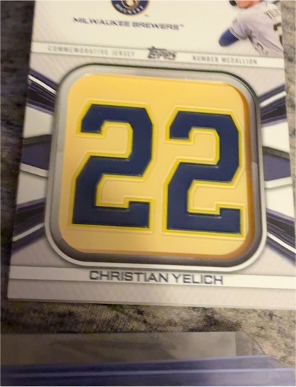 2022 Topps Series 1 #JNM-CY Christian Yelich Jersey Number Medallion — front