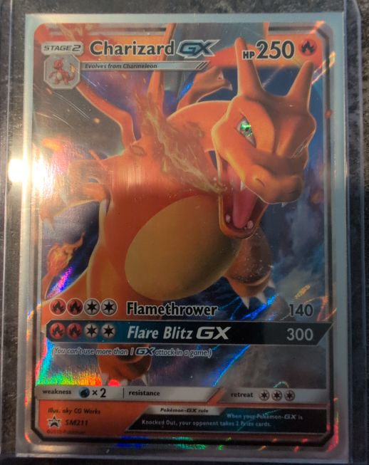 Pokémon SM Black Star Promo #SM211 Charizard GX — front