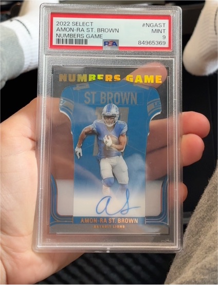 2022 Panini Select #NGAST Amon-Ra St. Brown Numbers Game — front