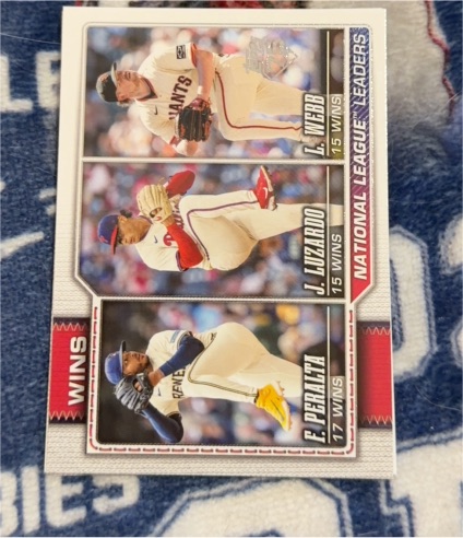 2026 Topps Series 1 #117 National League Wins Leaders Freddy Peralta / Jesús Luzardo / Logan Webb — front