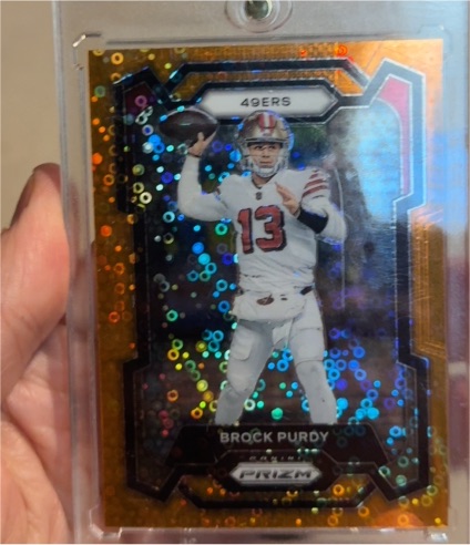 2023 Panini Prizm #266 Brock Purdy Orange Disco Prizm — front