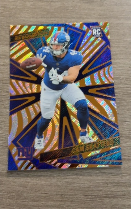 2025 Panini Revolution #207 Cam Skattebo — front