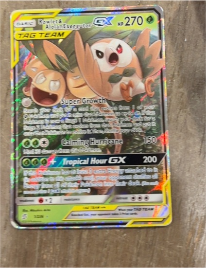 2019 Pokémon Unified Minds #1 Rowlet & Alolan Exeggutor GX — front