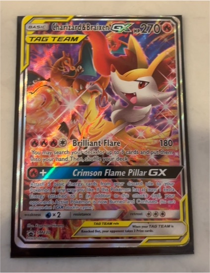 2016 Pokémon SM Black Star Promo #SM230 Charizard & Braixen GX — front