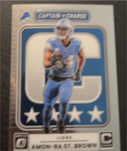 2025 Donruss Optic #2 Amon-Ra St. Brown Captain in Charge — front
